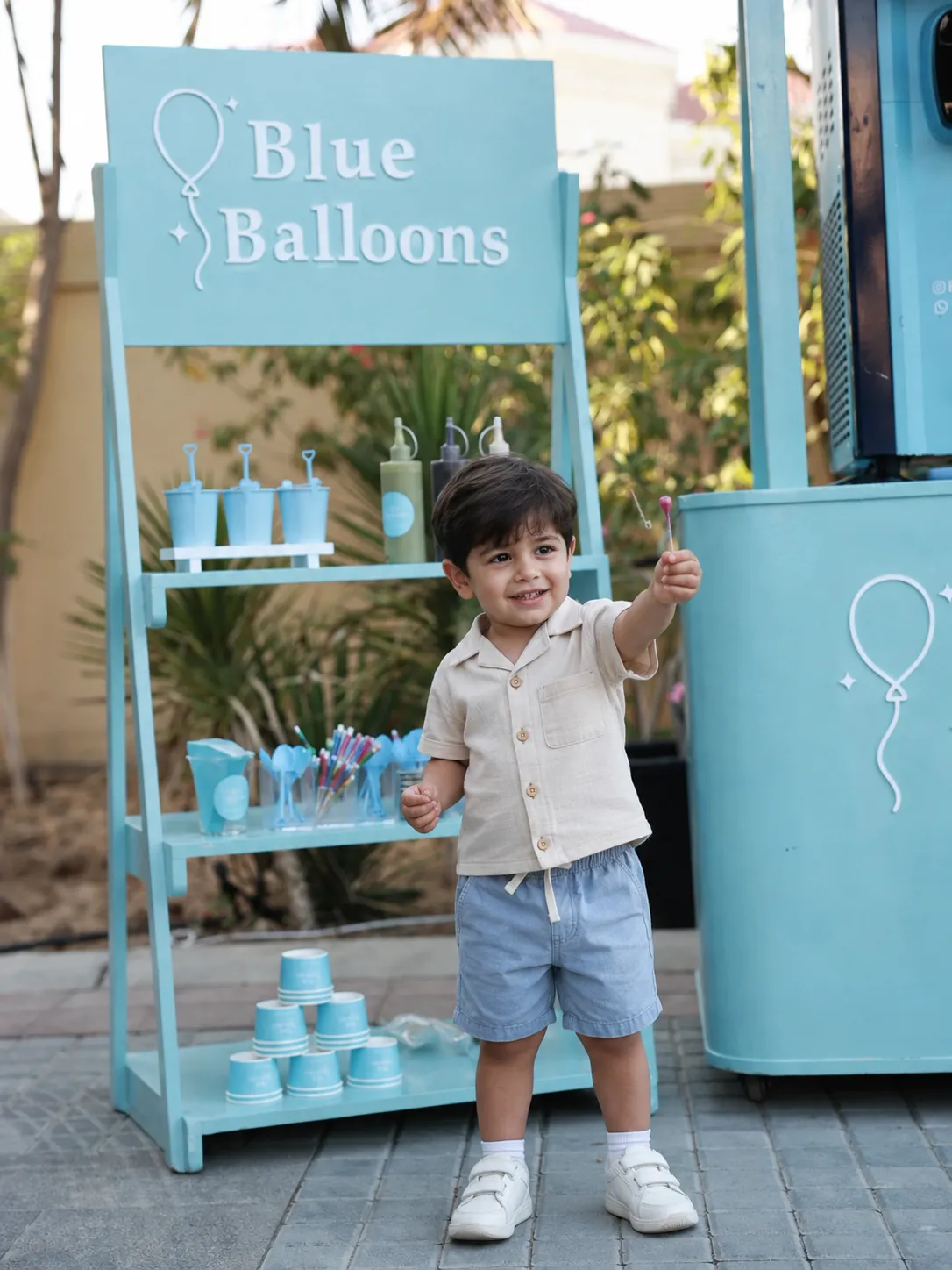 Guest interaction at a Blue Balloons station